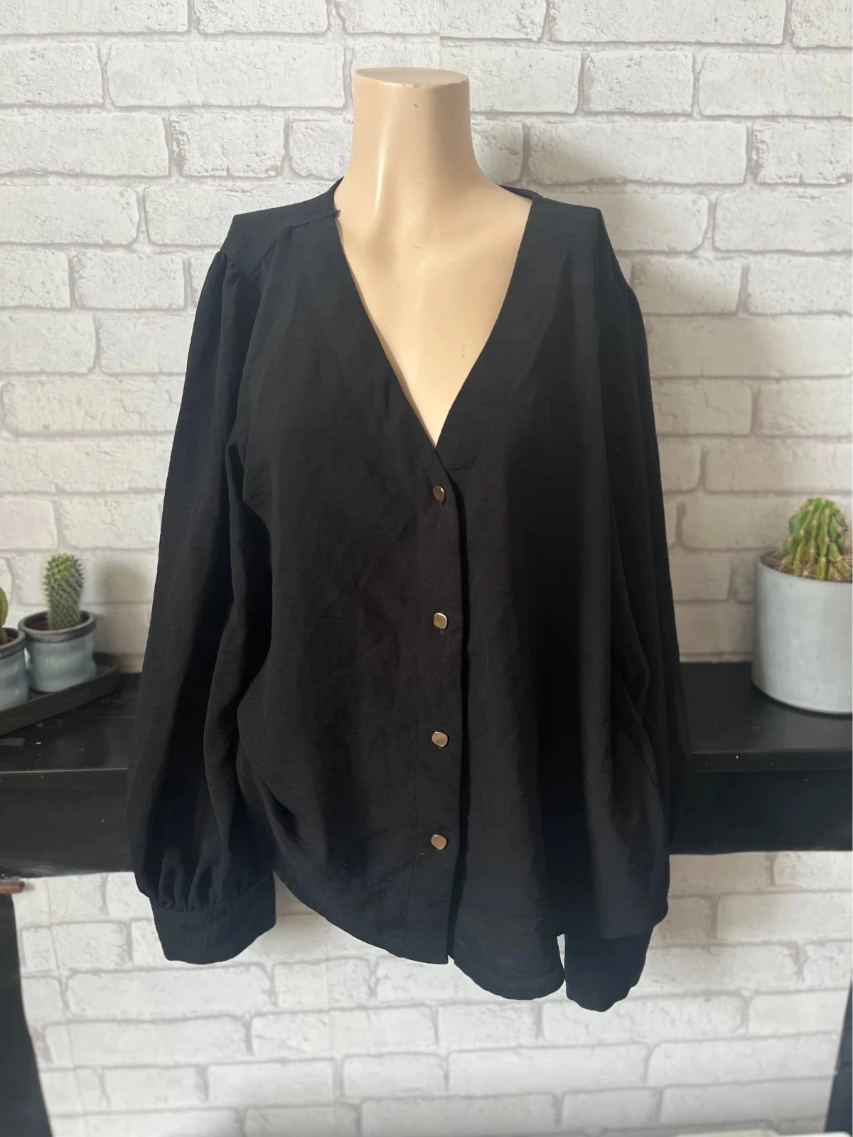 Blouse noire élégante – Taille 42 – AMISU